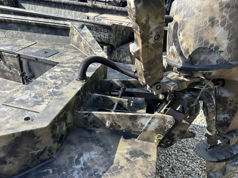 Slide: The Image of Camouflage-patterned Excel Viper F4 1751 boat, showcasing motor and deck details, 2025 model. - 12