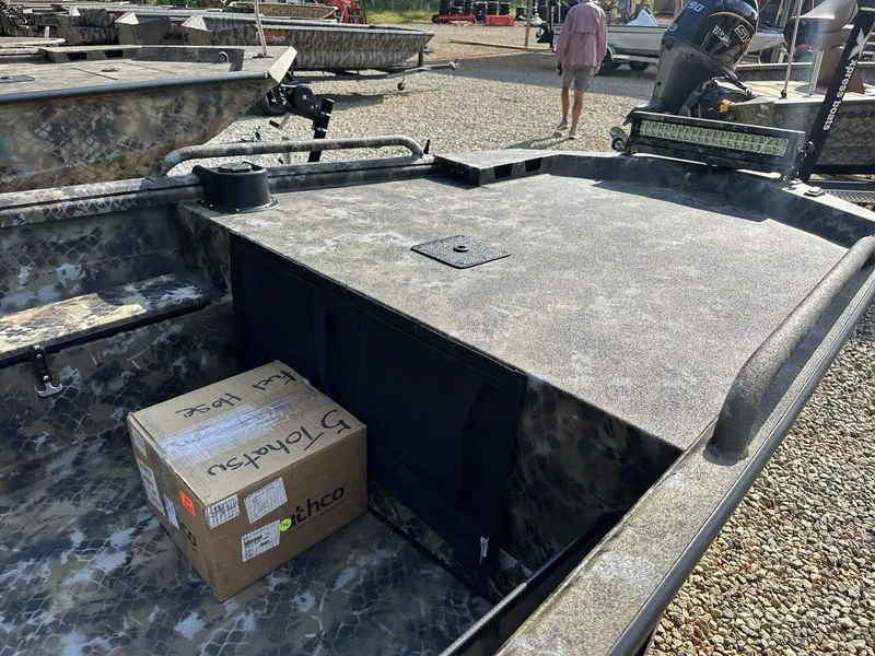 Slide: The Image of 2025 Excel Viper F4 1751 boat with camo design, box on deck, and outboard motor. - 8