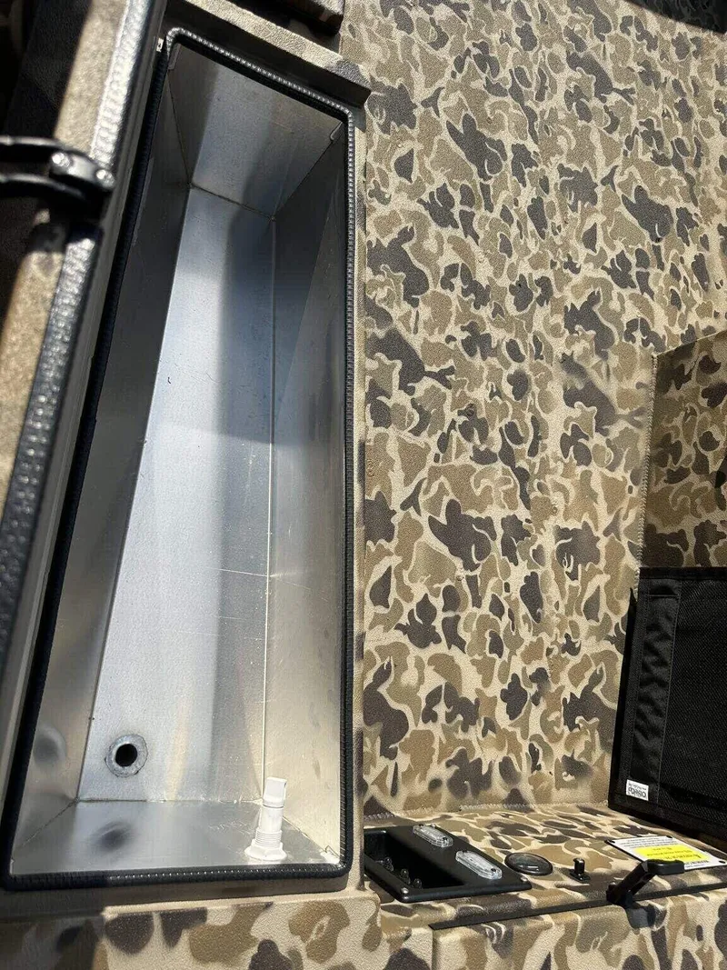 Slide: The Image of Camouflage interior of 2025 Excel Viper F4 1751 boat with storage compartment. - 8