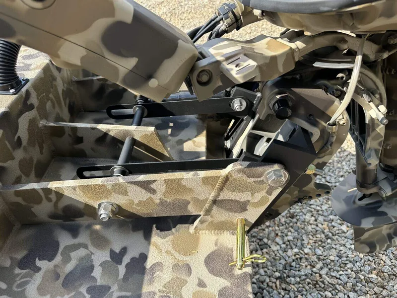 Slide: The Image of Camouflage-patterned Excel Viper F4 1751, 2025 model, mechanical components close-up. - 9