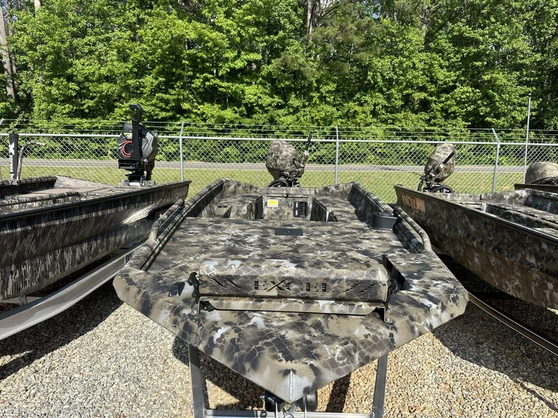 Slide: The Image of 2025 Excel Viper F4 1751 boat with camouflage design, displayed outdoors. - 2