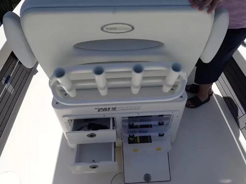 Slide: The Image of 2024 Pathfinder 2600 TRS boat console with rod holders and storage drawers. - 11