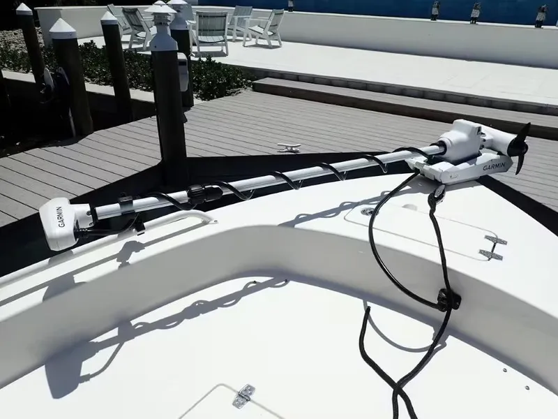 Slide: The Image of 2024 Pathfinder 2600 TRS boat with Garmin trolling motor at dockside. - 15