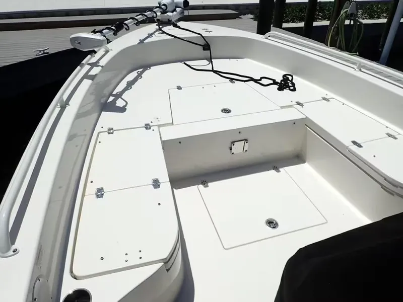 Slide: The Image of 2024 Pathfinder 2600 TRS boat deck with storage compartments and trolling motor. - 18