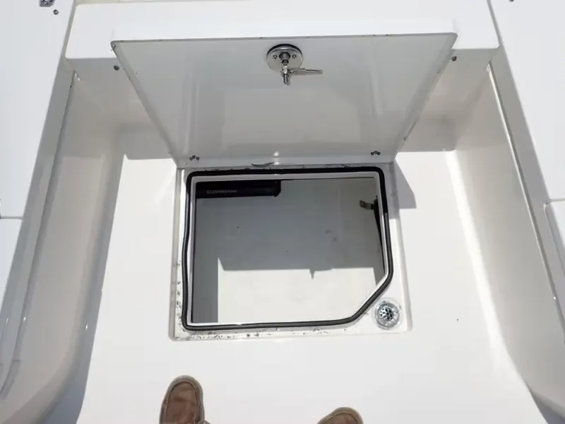 Slide: The Image of Open storage compartment on 2024 Pathfinder 2600 TRS boat deck. - 20