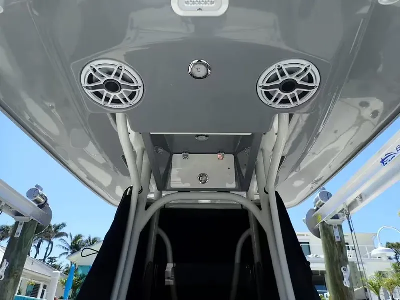 Slide: The Image of 2024 Pathfinder 2600 TRS boat interior with speakers and overhead console. - 4