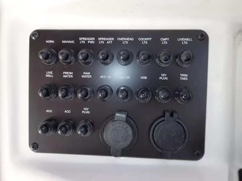 Slide: The Image of Control panel of 2024 Pathfinder 2600 TRS boat with labeled switches and plugs. - 9