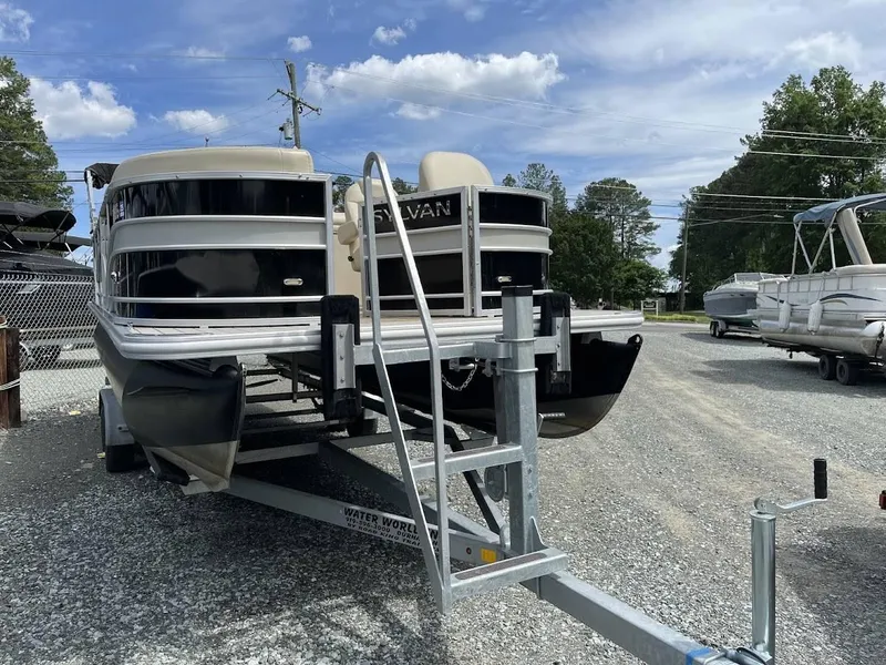 Slide: The Image of 2018 Sylvan Mirage 8522 Cruise Port pontoon boat on trailer, parked outdoors. - 1