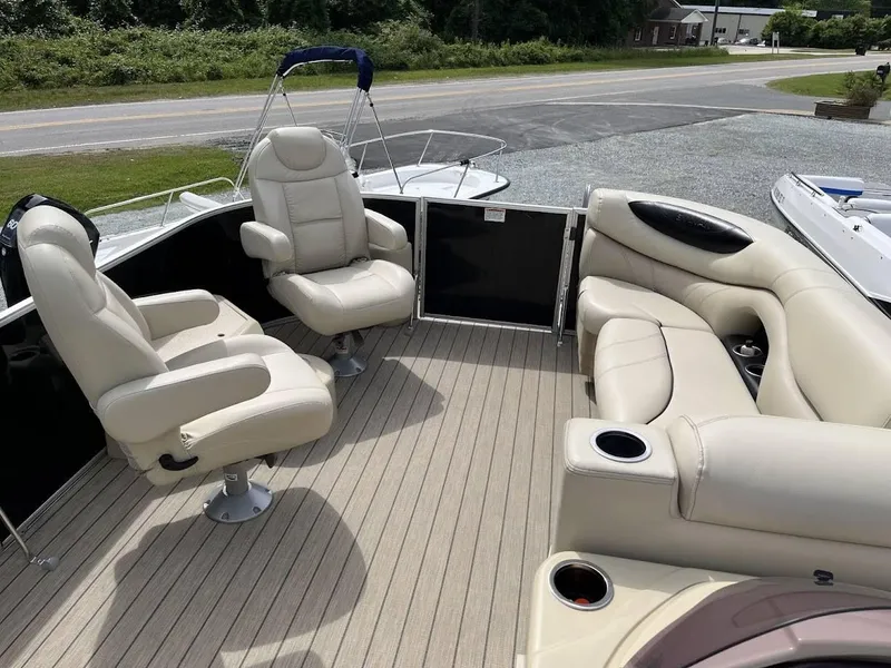 Slide: The Image of 2018 Sylvan Mirage 8522 Cruise Port pontoon boat with beige seating and cup holders. - 13