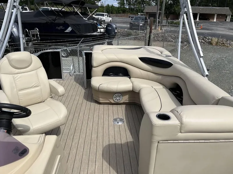 Slide: The Image of Luxurious 2018 Sylvan Mirage 8522 Cruise Port with beige seating and spacious deck. - 14
