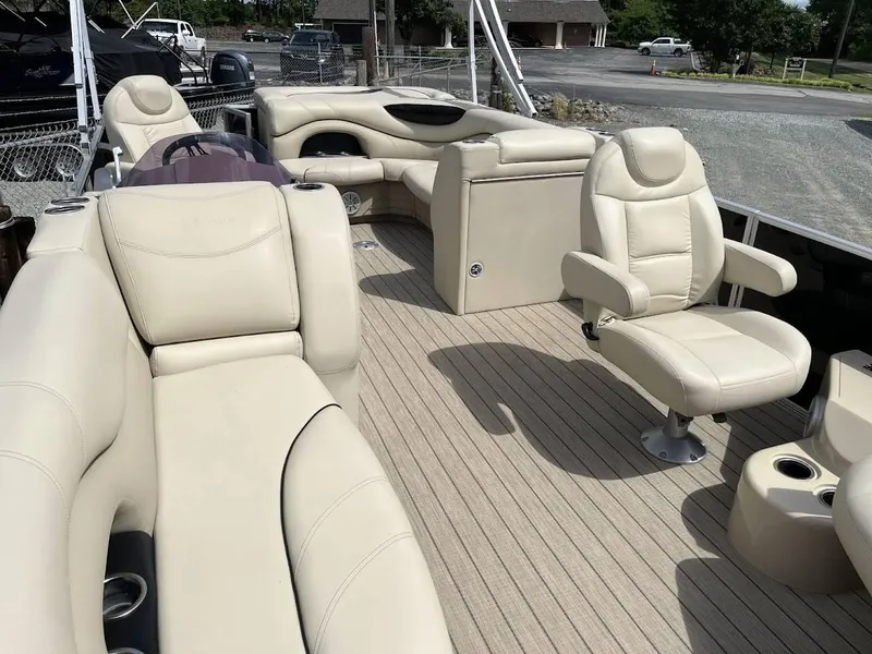 Slide: The Image of 2018 Sylvan Mirage 8522 Cruise Port with beige seating and spacious deck layout. - 6