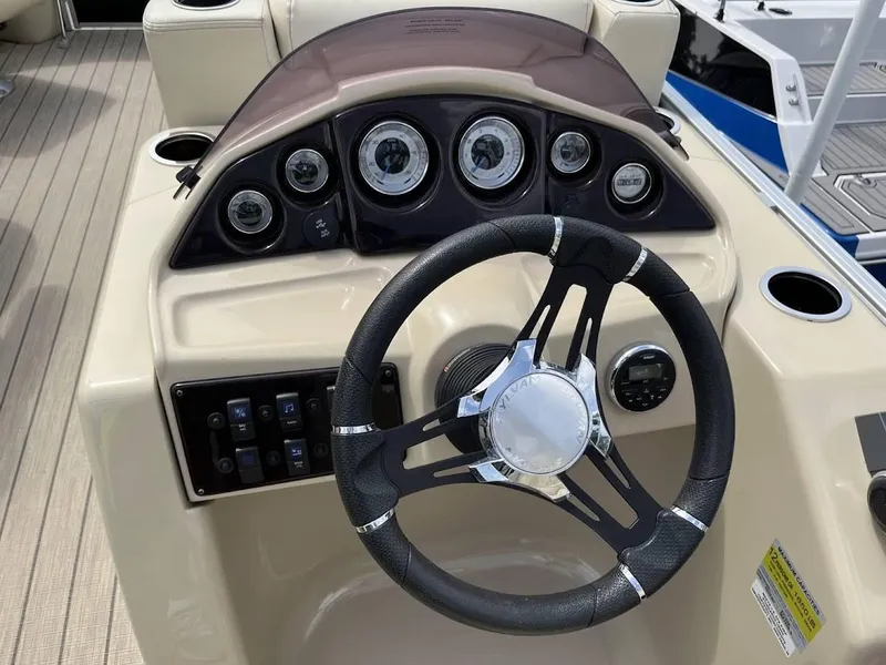 Slide: The Image of Steering console of 2018 Sylvan Mirage 8522 Cruise Port boat with gauges and controls. - 9