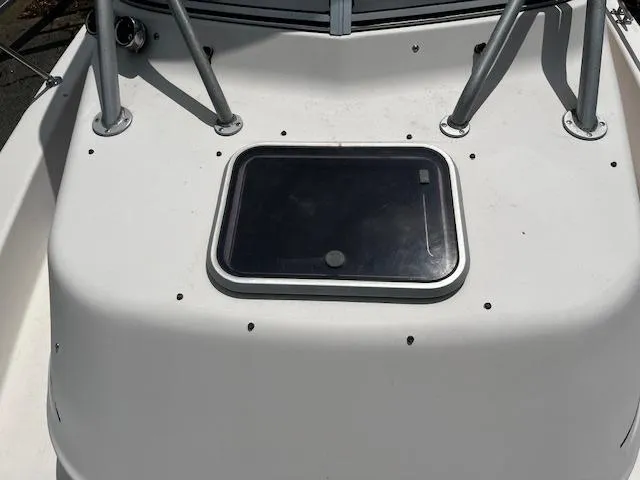 Slide: The Image of 1997 Grady-White F-26 Tigercat boat deck with hatch and metal supports. - 9