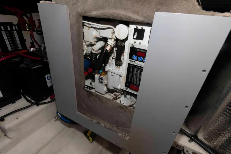 Slide: The Image of Engine compartment of 2007 Sea Ray 280 Sundancer with visible Kohler generator. - 13