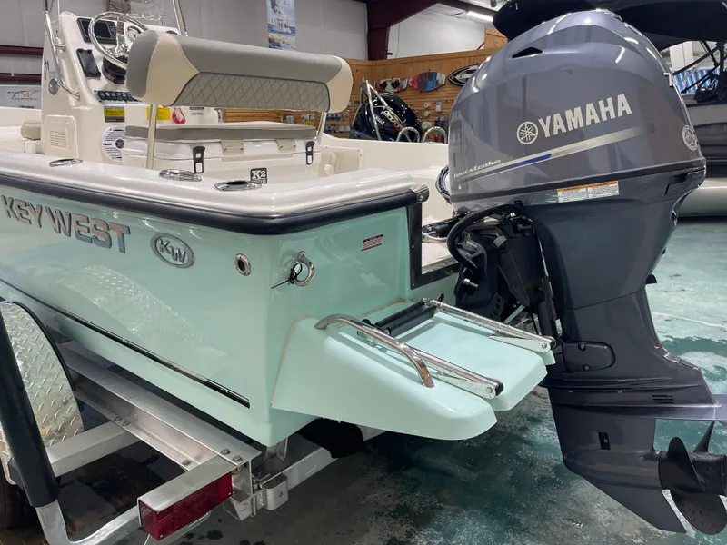Slide: The Image of 2025 Key West 1720CC boat with Yamaha outboard motor on a trailer. - 12