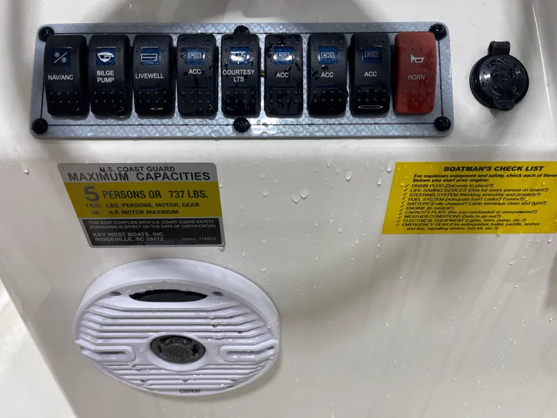 Slide: The Image of Control panel of 2025 Key West 1720CC boat with capacity and safety checklist. - 20