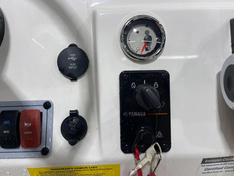 Slide: The Image of Control panel of 2025 Key West 1720CC boat with Yamaha ignition and USB input. - 22