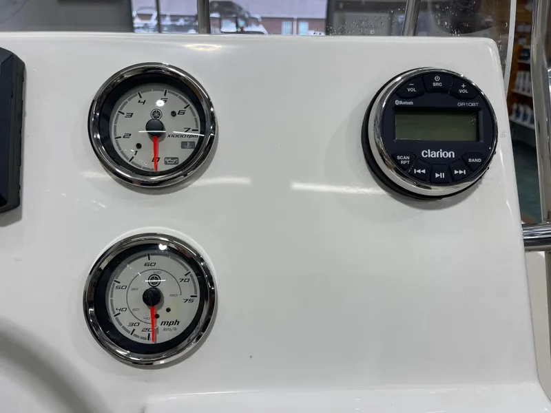 Slide: The Image of Dashboard of 2025 Key West 1720CC boat with gauges and Clarion audio system. - 23
