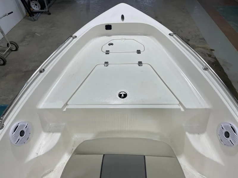 Slide: The Image of 2025 Key West 1720CC boat interior with storage compartments and speakers. - 26