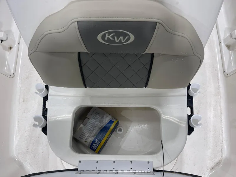 Slide: The Image of 2025 Key West 1720CC boat seat with storage compartment and cup holders. - 28