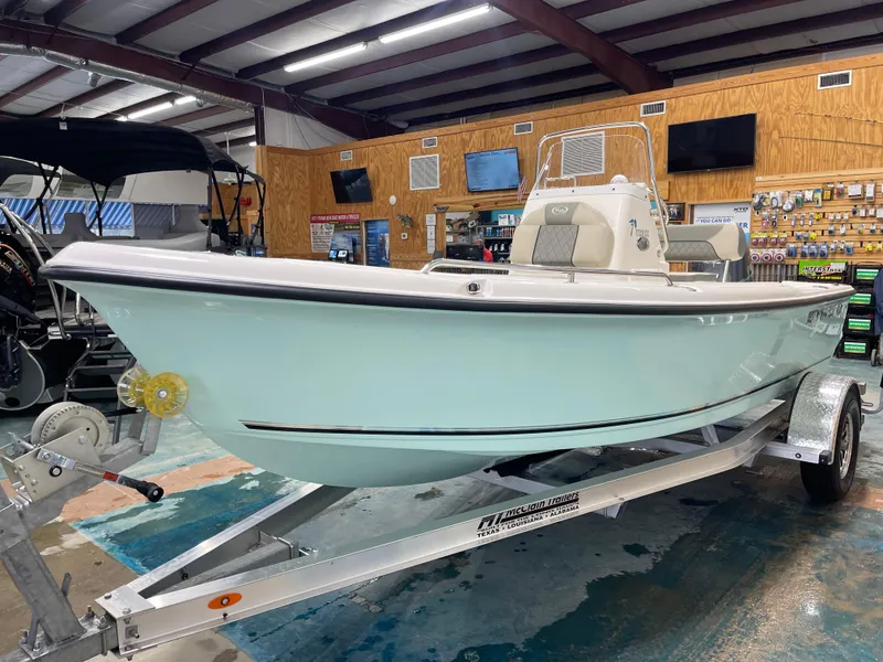 Slide: The Image of 2025 Key West 1720CC boat on trailer in showroom, side view. - 7