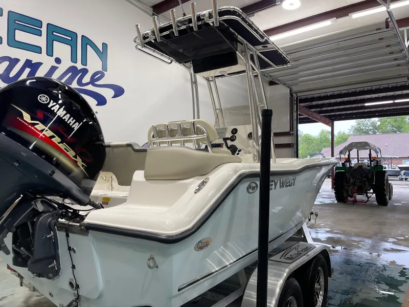 Slide: The Image of 2025 Key West 203FS boat with Yamaha engine in a marine garage. - 10