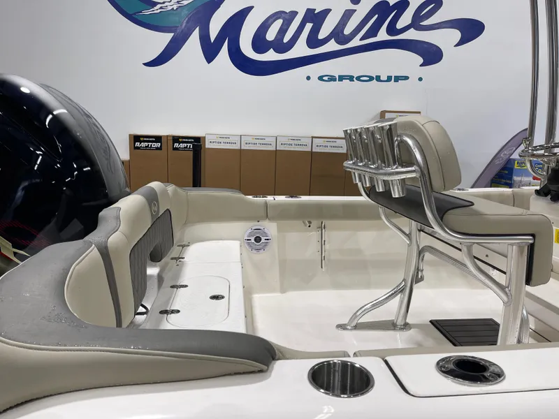 Slide: The Image of 2025 Key West 203FS boat interior with seating and rod holders, displayed at Marine Group. - 11