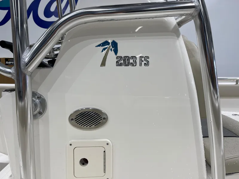Slide: The Image of 2025 Key West 203FS boat console with logo and stainless steel railings. - 13