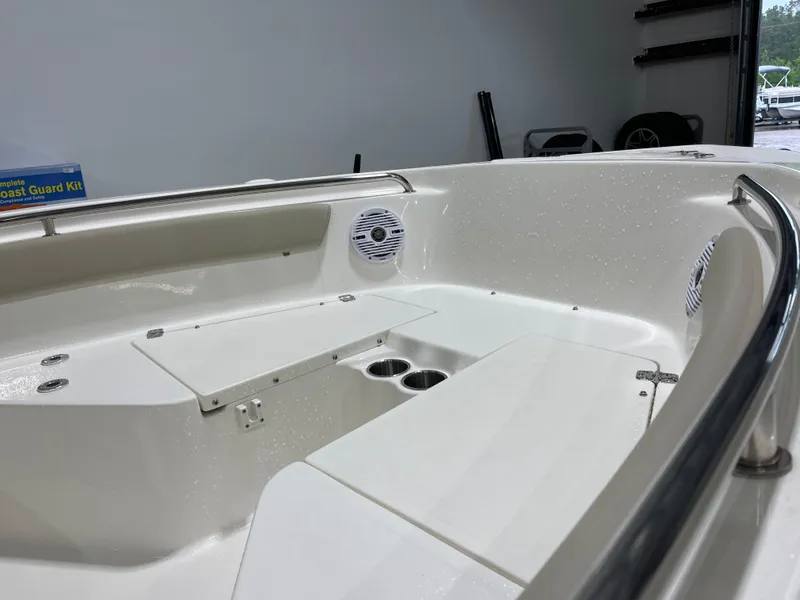 Slide: The Image of 2025 Key West 203FS boat interior with seating and cup holders. - 15