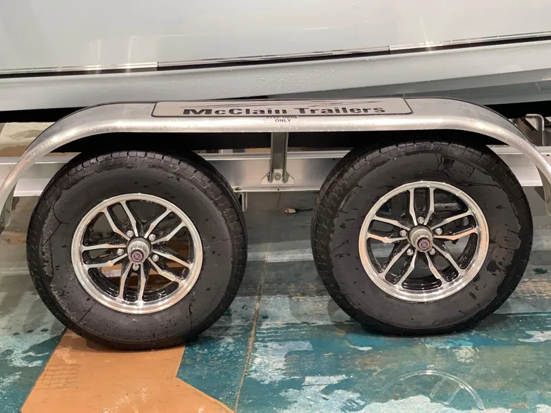 Slide: The Image of Trailer wheels of a 2025 Key West 203FS on McClain Trailers. - 16