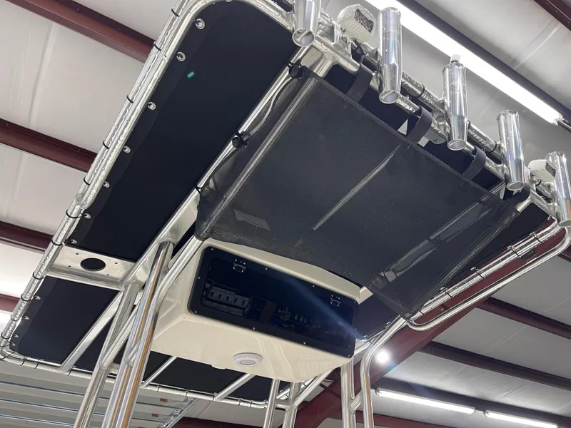 Slide: The Image of 2025 Key West 203FS boat T-top with rod holders and storage compartment. - 26