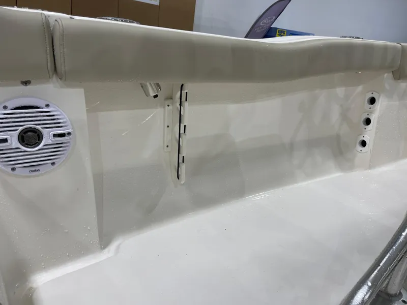 Slide: The Image of 2025 Key West 203FS boat interior with speaker and rod holders. - 29