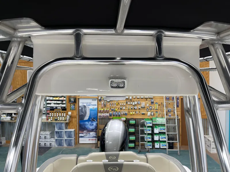 Slide: The Image of 2025 Key West 203FS boat interior with metal framework and store background. - 30