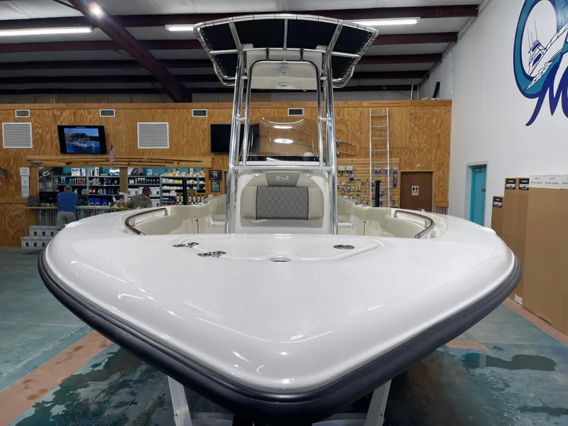 Slide: The Image of 2025 Key West 203FS boat displayed indoors, showcasing sleek design and modern features. - 5