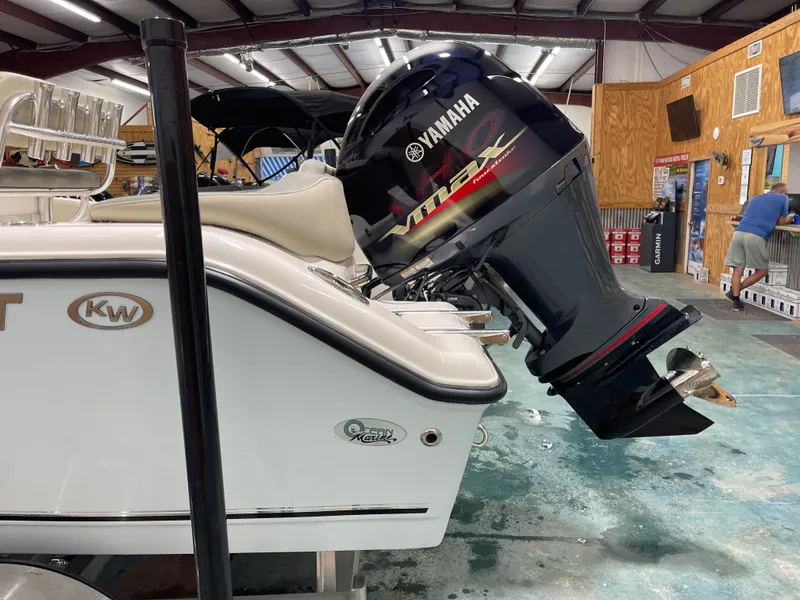 Slide: The Image of 2025 Key West 203FS boat with Yamaha VMAX engine in a workshop setting. - 7