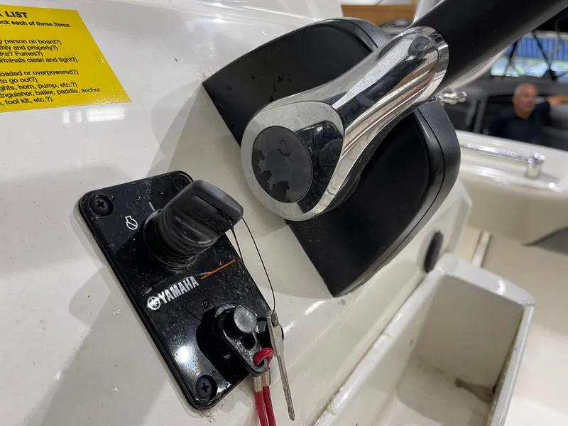 Slide: The Image of Close-up of Yamaha throttle control on 2025 Key West 219fs boat dashboard. - 16