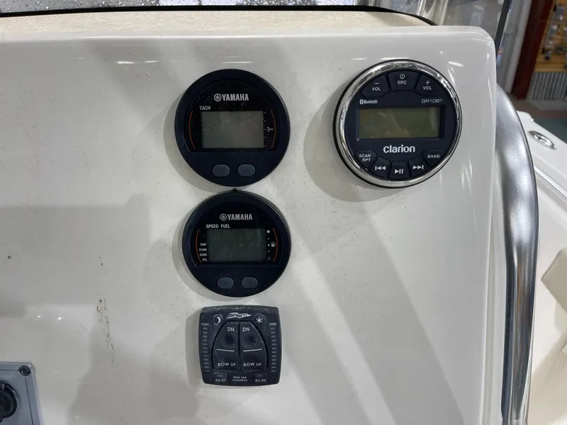 Slide: The Image of Control panel of 2025 Key West 219fs boat with Yamaha gauges and Clarion audio system. - 17