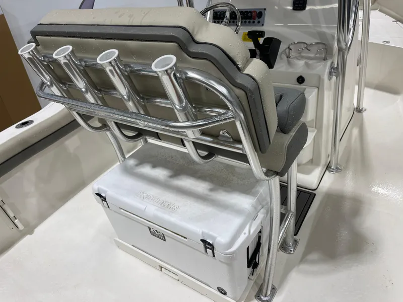 Slide: The Image of 2025 Key West 219fs boat interior with rod holders and cooler storage. - 20