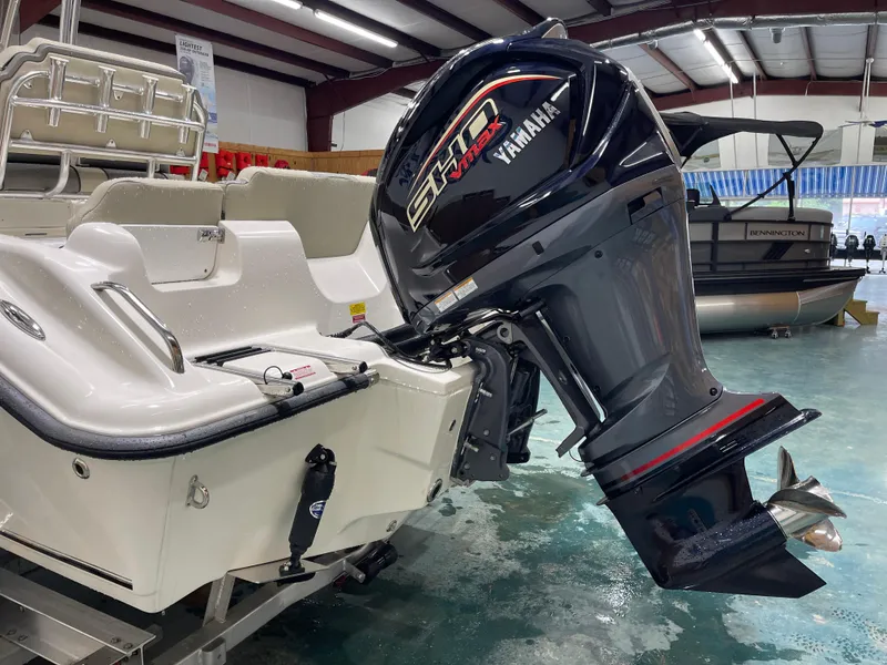 Slide: The Image of 2025 Key West 219fs boat with Yamaha VMAX outboard motor in showroom. - 7