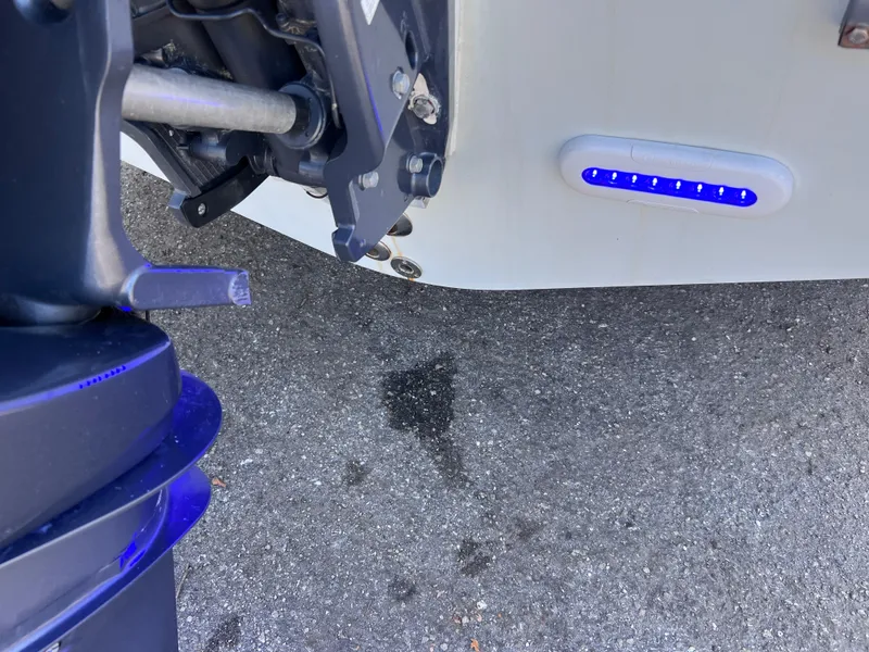 Slide: The Image of Rear view of a 2003 Contender 21 Open boat with Yamaha 250 engine. - 12