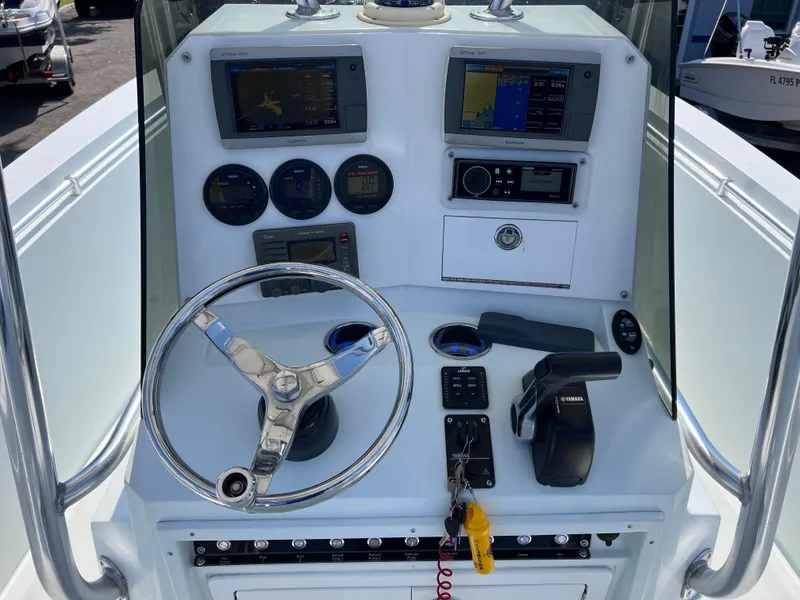 Slide: The Image of Center console of 2003 Contender 21 Open boat with modern controls and gauges. - 13