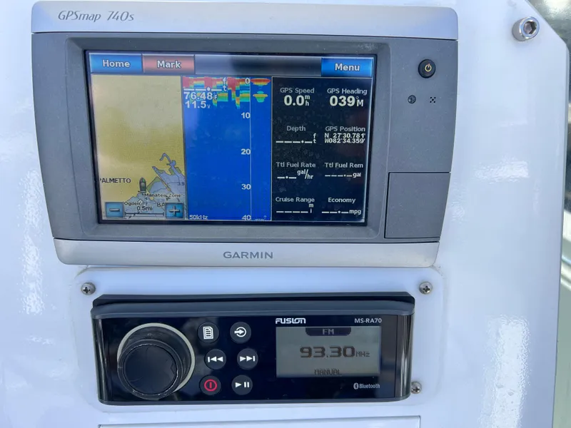 Slide: The Image of Garmin GPSmap 740s and Fusion MS-RA70 display on Contender 21 Open boat dashboard. - 15
