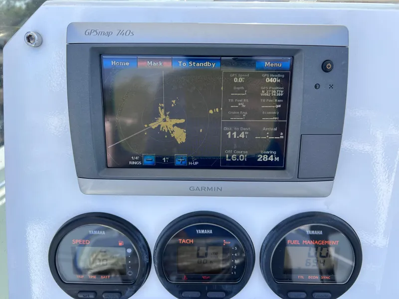 Slide: The Image of Dashboard of 2003 Contender 21 Open with Garmin GPS and Yamaha gauges. - 16