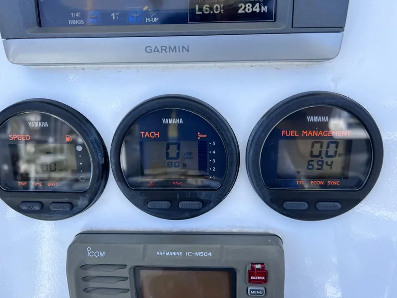 Slide: The Image of Dashboard of 2003 Contender 21 Open with Yamaha gauges and Garmin display. - 17