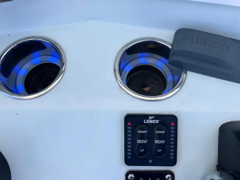 Slide: The Image of Cup holders and Lenco controls on 2003 Contender 21 Open boat dashboard. - 19