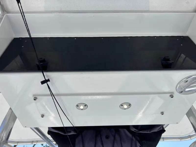 Slide: The Image of Contender 21 Open boat console with storage, 2003 model, featuring a 2014 Yamaha 250 engine. - 20