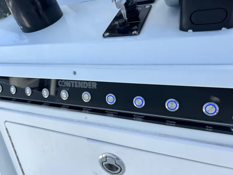 Slide: The Image of Control panel of a 2003 Contender 21 Open boat with Yamaha 250 engine. - 22