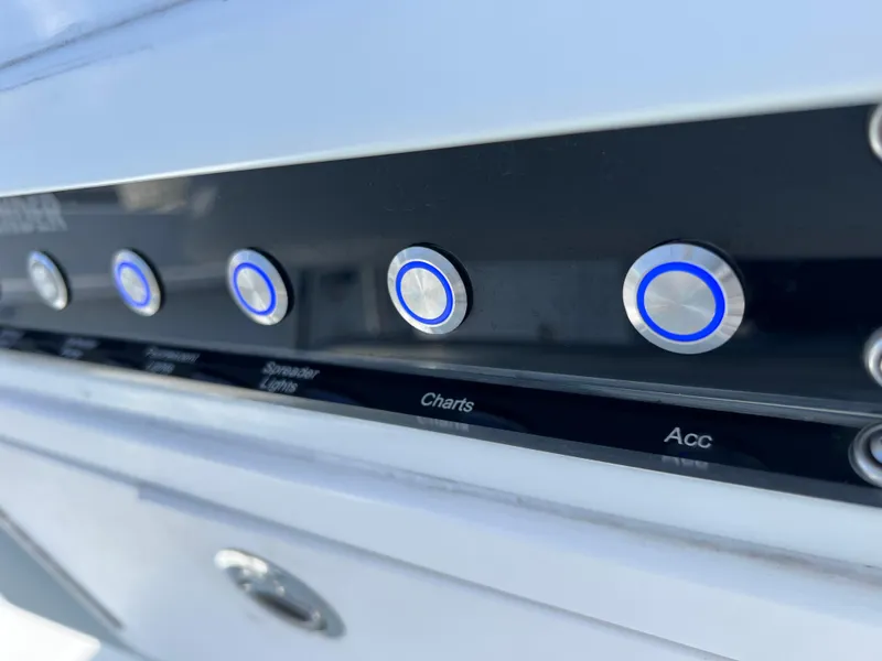 Slide: The Image of Control panel of 2003 Contender 21 Open boat with labeled buttons. - 23