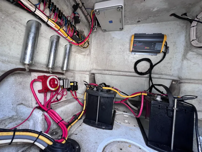 Slide: The Image of Electrical system of a 2003 Contender 21 Open boat with batteries and wiring. - 24