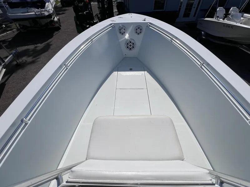 Slide: The Image of Bow view of 2003 Contender 21 Open boat, featuring spacious seating and speakers. - 28